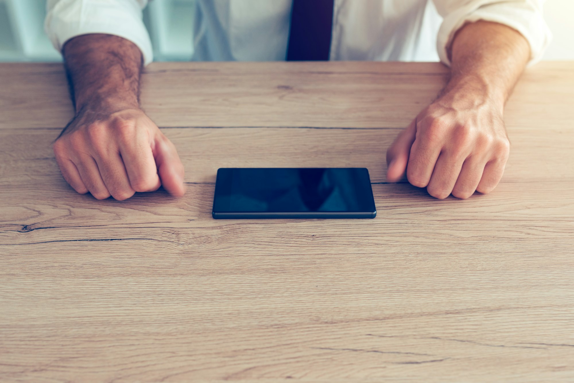 Businessman fighting mobile phone addiction crisis