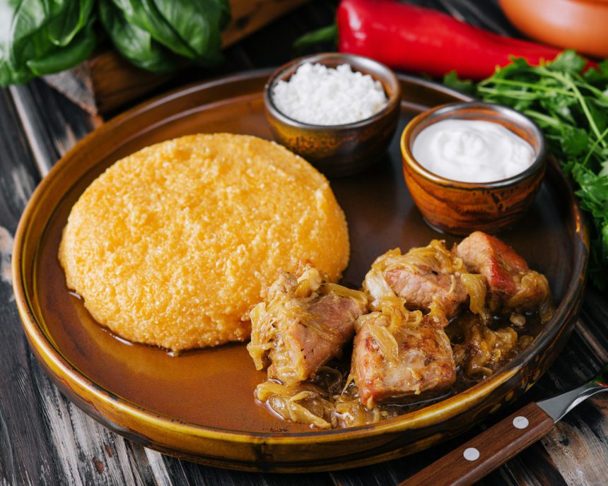 Traditional Moldavian, Romanian cornmeal porridge with meat and sauce